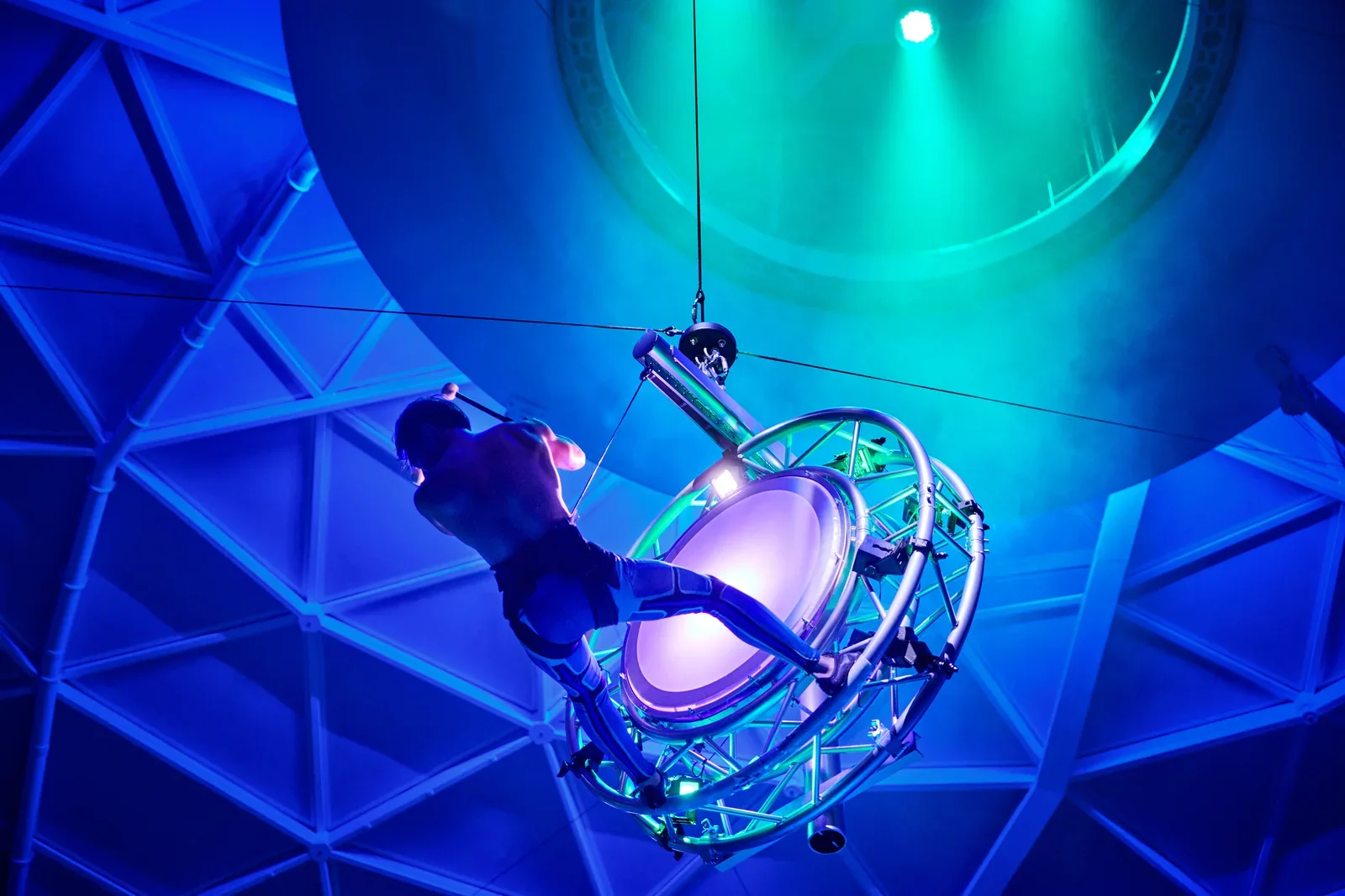 AquaTheater performer suspended inside the AquaDome on Icon of the Seas during a live show